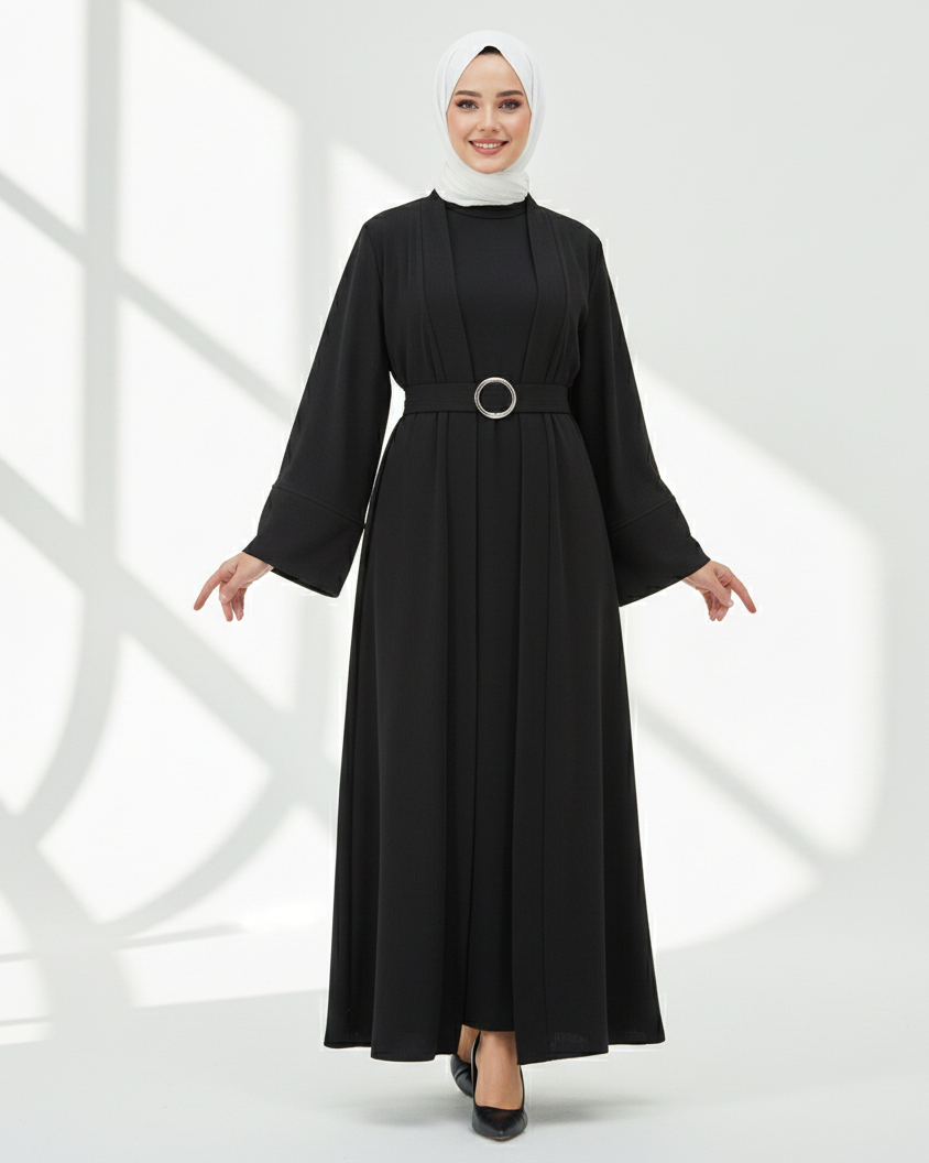 Woman wearing a black abaya with a belt on a white background