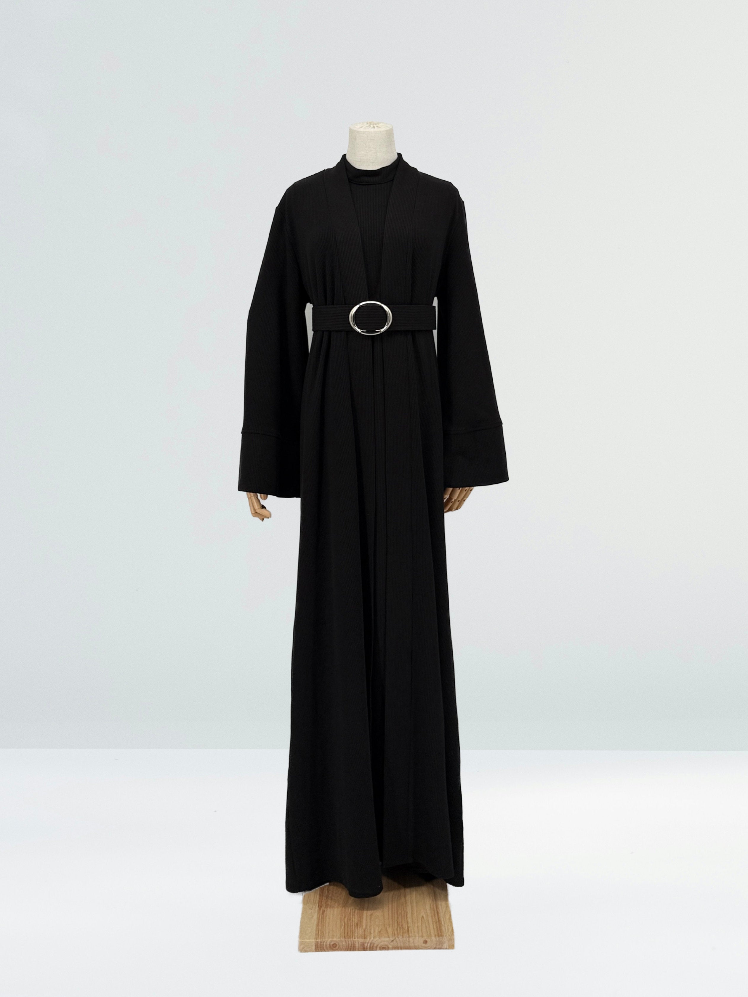 black abaya dress with a belt on a mannequin against a white background