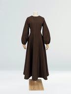 brown flare dress on a mannequin against a plain background