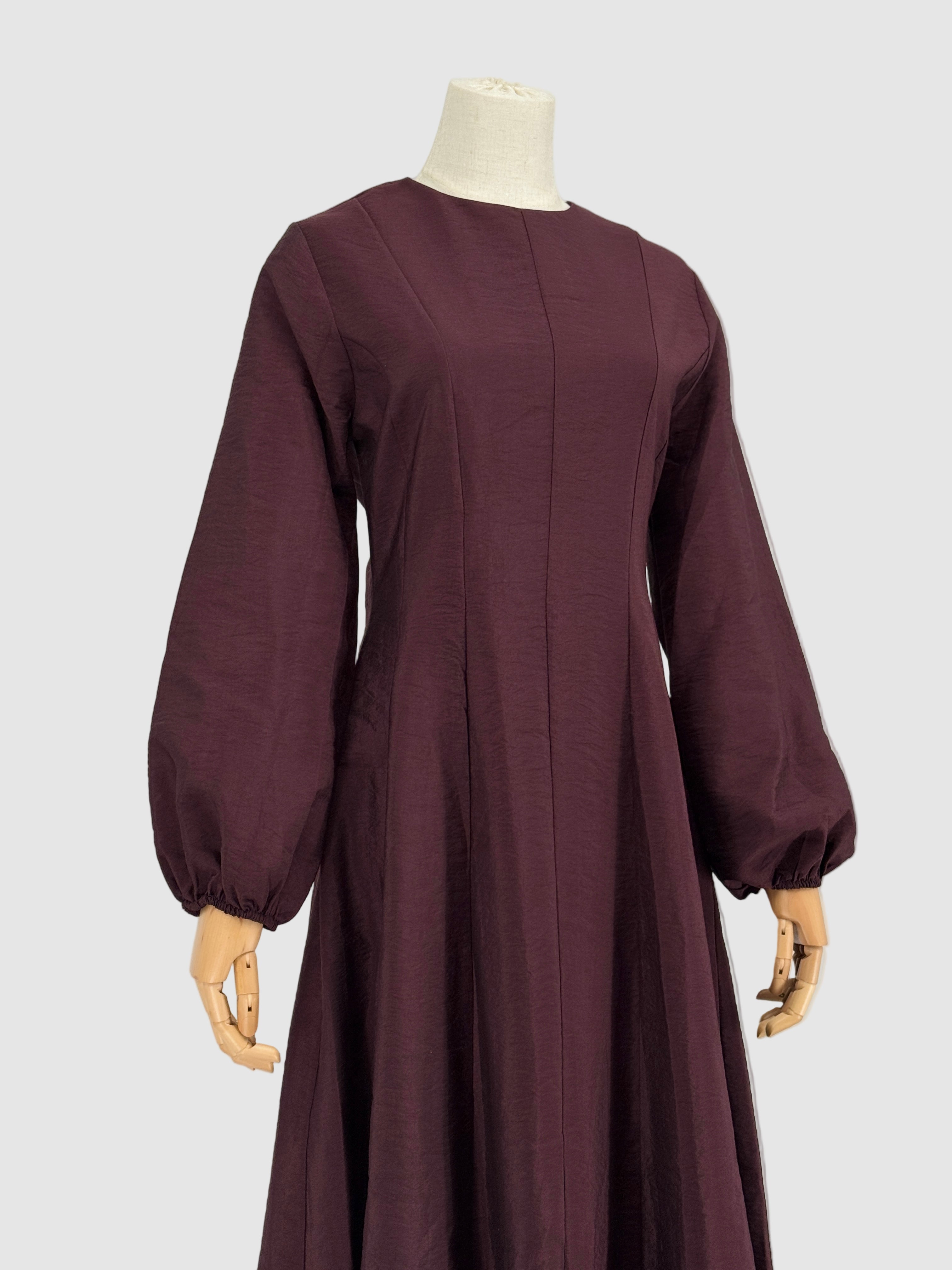 Burgundy flare dress on a mannequin against a plain background