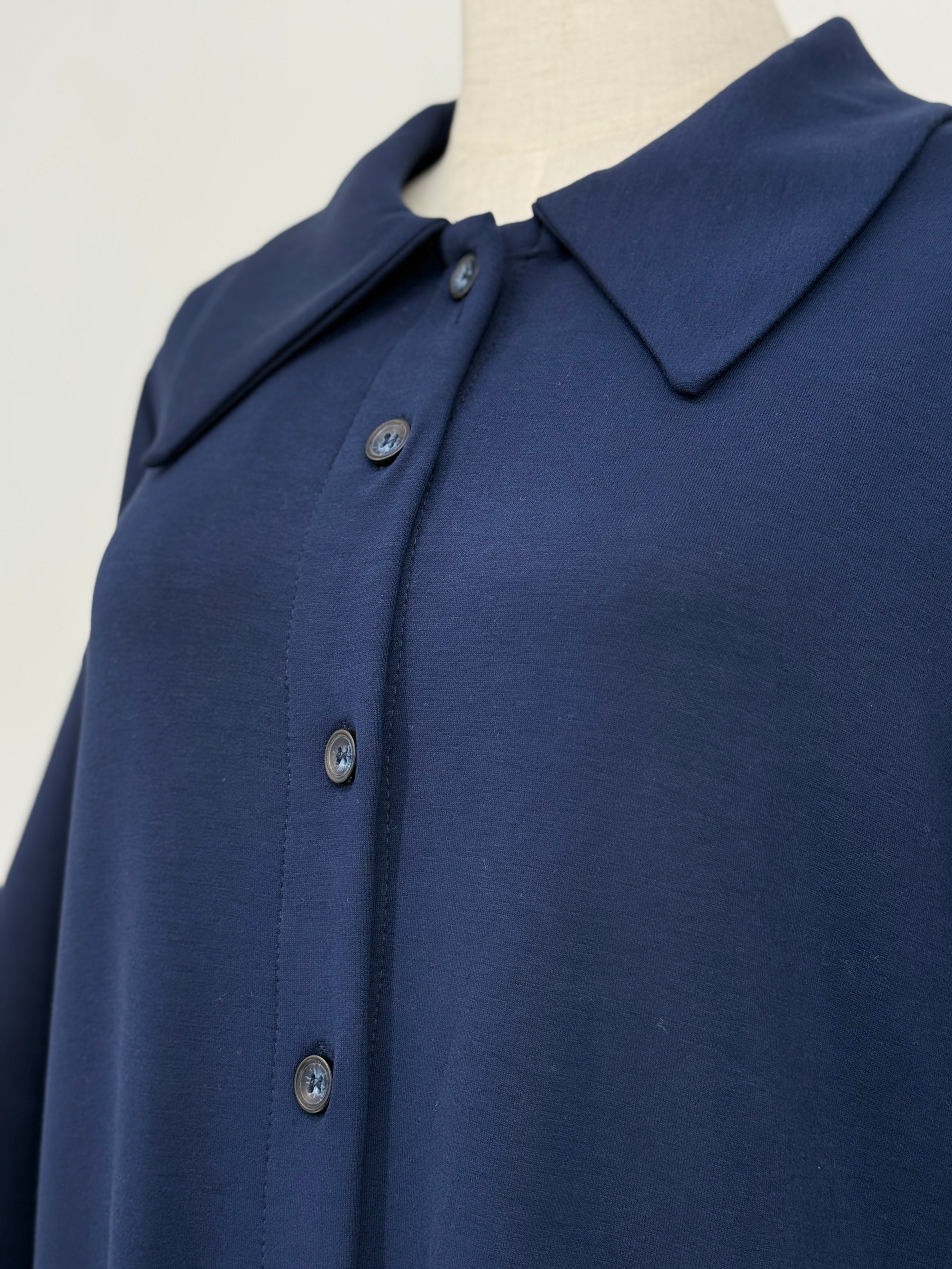 close-up on a navy long matching set on a mannequin against a white background