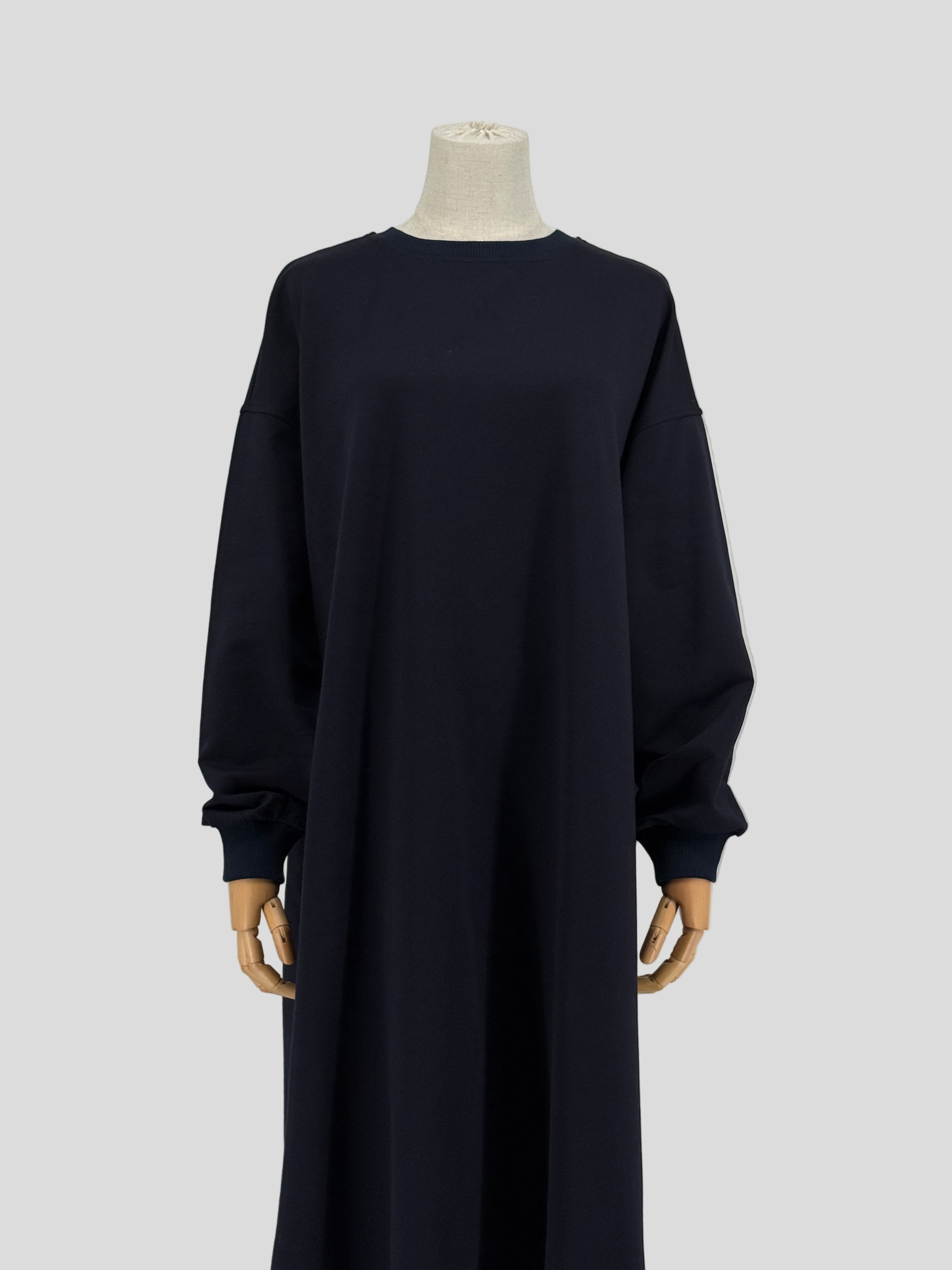 navy blue long-sleeve tunic on a mannequin against a white background